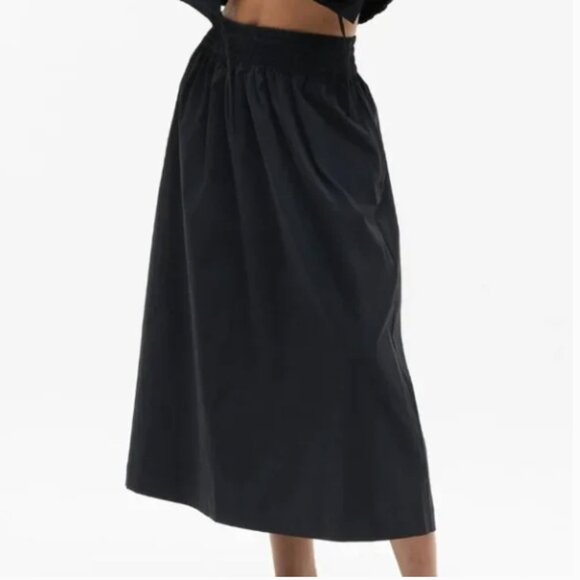 NWT Athleta Midday Mid Rise Midi Poplin Skirt Small Black Pockets Elastic Waist - Picture 1 of 8